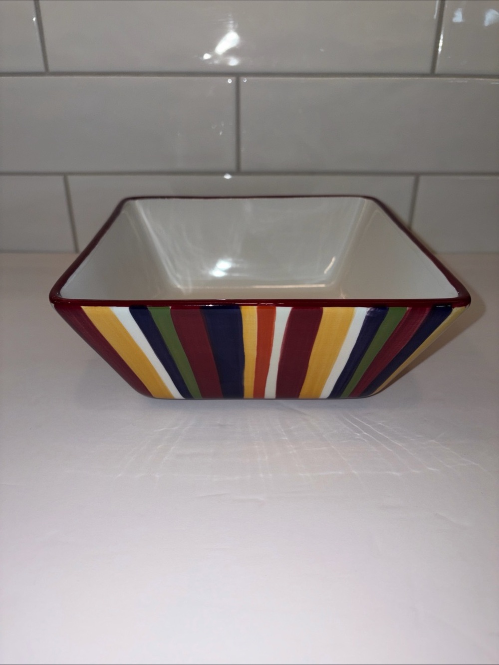 The Pampered Chef Square Ceramic Dish with Red and Multicolor Stripe Trim